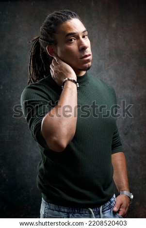 Man with rasta braids isolated on abstract background