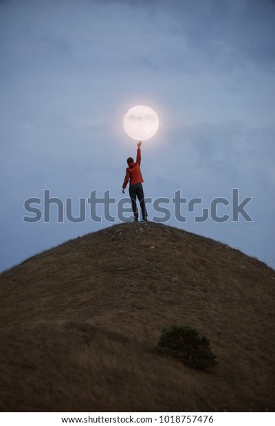 Man reaching the full moon.                             \
 