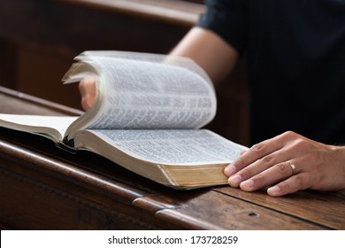 Man Reading Bible In The Church.