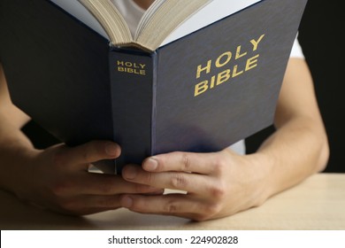 Man Reading Bible Close Up