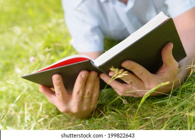 Man Reading Book Outside