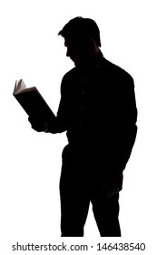 Man Reading A Book In Silhouette And Isolated On White Background