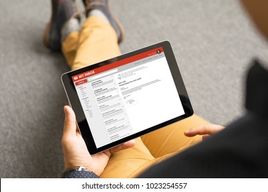 Man reading email on tablet