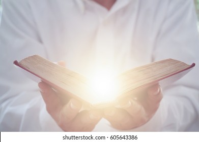 A Man Reading The Holy Bible.