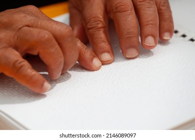 Man Reading  The Holy Bible In Braille.  Strasbourg. France.