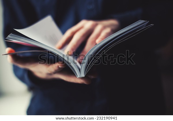 man reading a\
magazine