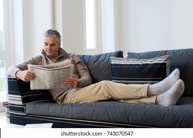 Man Reading Newspaper