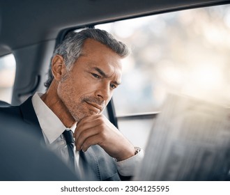 Man, reading newspaper and car for business travel, journey or drive while thinking of news. Professional male person with media paper in passenger seat for work with luxury transportation or a taxi - Powered by Shutterstock