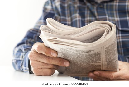 Man Reading Newspaper On Table