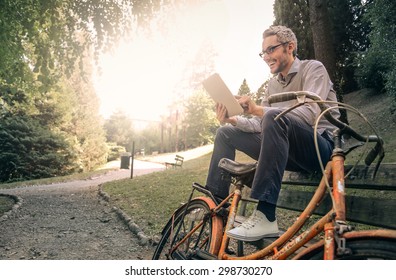 Man reading at the park - Powered by Shutterstock