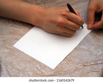 A man is ready to write on white paper