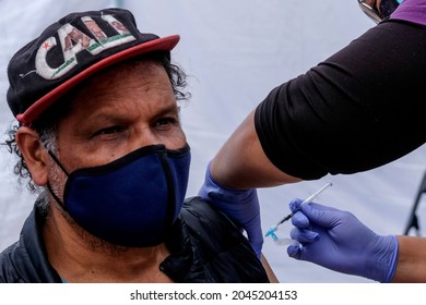 A Man Receives A COVID-19 Vaccination Dose At A Mobile Clinic Run By The South Central Family Health Center At Historic Plaza Olvera In Downtown Los Angeles, Tuesday, Sept., 2021.