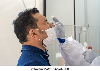 A man receives nasal swab test for Covid-19.