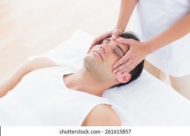 Man Receiving Head Massage In Medical Office