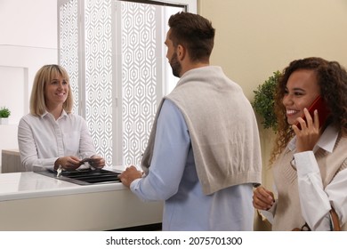 Man Receiving Money At Cash Department Window In Bank. Currency Exchange