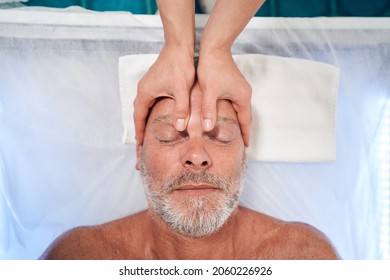 Man Receiving Professional Scalp Massage In Spa Salon