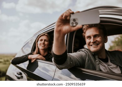 Man recoding video on road trip photo