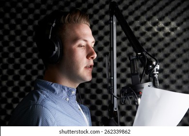 Man In Recording Studio Talking Into Microphone