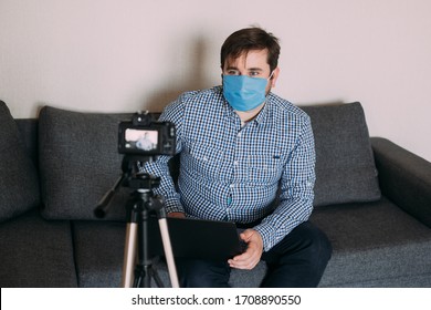 Man Recording Video Blog Tells How To Protect Yourself From 2019-nCov. Blogger Talks Mers-cov How To Use Of Alcohol Wipes, Thermometer. Influencer Man Blogger In Medical Mask Talks About Coronavirus.