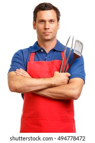 Man In Red Bbq Kitchen Chef Apron And Blue Polo Shirt With Barbecue Cooking Utensils Isolated On White Background