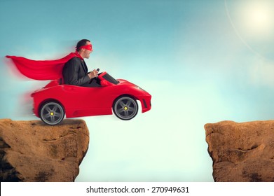 Man In A Red Car Jumping A Ravine