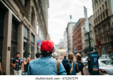 Man In Red Hat Exploring The City