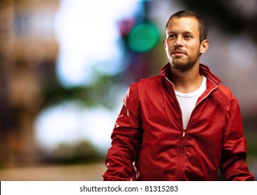 Man With Red Jacket With A City As A Background