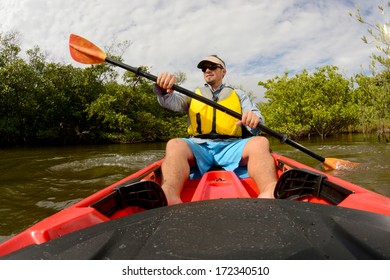 Man In Red Kayak In Florida