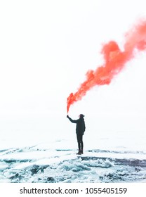 Man With Red Smoke Bomb On The Field