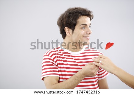 Similar – Image, Stock Photo Two red heart lollipop pattern on pink background