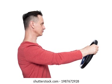 Man In Red T-shirt With A Steering Wheel, Side View, Isolated On White Background. Car Drive Concept