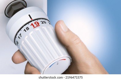 Man reducing energy consumption by setting thermostat temperature to 19 degrees. Close up on a knob. Composite image between a 3d illustration and a hand photography. - Shutterstock ID 2196471575