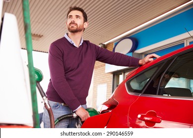 Man Refuelling A Car At A Petrol Station