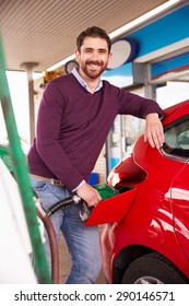 Man Refuelling A Car At A Petrol Station