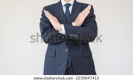 A man in a refusal pose.