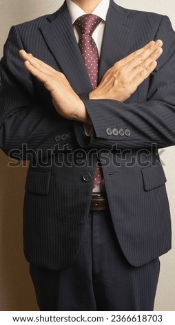 A man in a refusal pose.