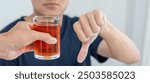 man refuses say no and avoid to drink an alcohol whiskey , stopping hand sign male, alcoholism treatment, alcohol addiction, quit booze, Stop Drinking Alcohol. Refuse Glass liquor, unhealthy, reject