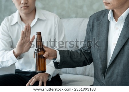 man refuses say no and avoid to drink alcohol at work, stopping hand sign male, alcoholism treatment, alcohol addiction, quit booze, Stop Drinking Alcohol. Refuse Glass liquor, unhealthy, reject