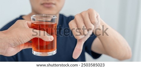 man refuses say no and avoid to drink an alcohol whiskey , stopping hand sign male, alcoholism treatment, alcohol addiction, quit booze, Stop Drinking Alcohol. Refuse Glass liquor, unhealthy, reject