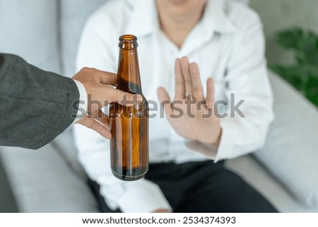 man refuses say no and avoid to drink an alcohol whiskey, stopping hand sign male, alcoholism treatment, alcohol addiction, quit booze, Stop Drinking Alcohol. Refuse Glass liquor, unhealthy, reject