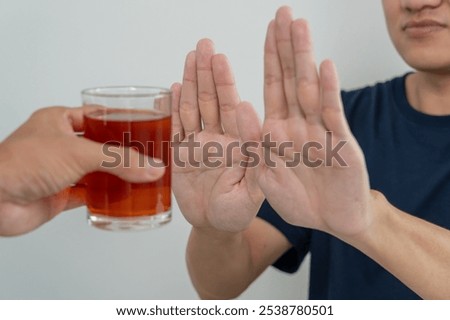man refuses say no and avoid to drink an alcohol whiskey, stopping hand sign male, alcoholism treatment, alcohol addiction, quit booze, Stop Drinking Alcohol. Refuse Glass liquor, unhealthy, reject