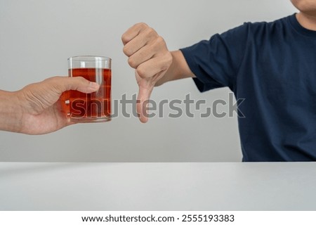 man refuses say no and avoid to drink an alcohol whiskey, stopping hand sign male, alcoholism treatment, alcohol addiction, quit booze, Stop Drinking Alcohol. Refuse Glass liquor, unhealthy, reject