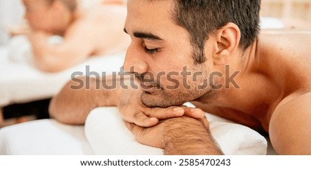 Similar – Image, Stock Photo Man relaxing during a chest massage at a spa with a serene expression.Wellness Hotel Concept image