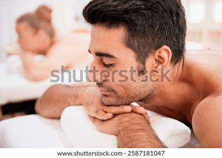Similar – Image, Stock Photo Man relaxing during a chest massage at a spa with a serene expression.Wellness Hotel Concept image