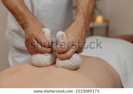 Image, Stock Photo Man relaxing during a chest massage at a spa with a serene expression.Wellness Hotel Concept image