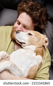 Man Relaxing With His Pet