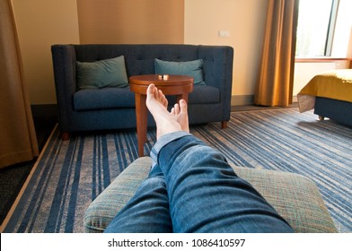 Man relaxing in living room - point of view perspective - Shutterstock ID 1086410597