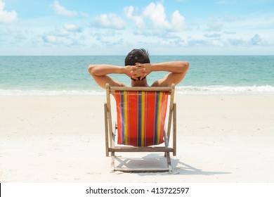 Man Relaxing On The Beach