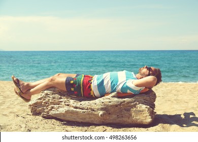 Man Relaxing On The Beach.