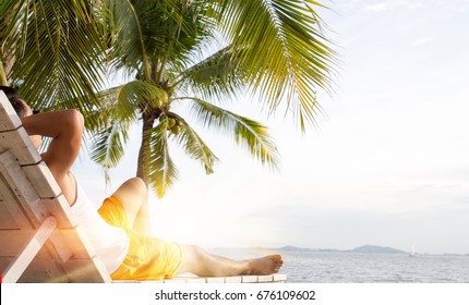 Man Relaxing On Beach On A Sunny Day. Summer Concept